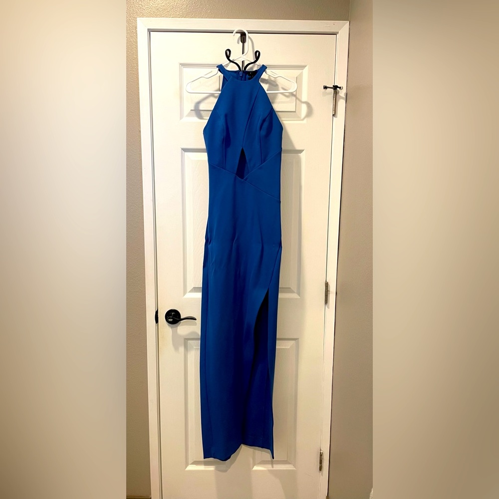 Bright blue classy formal dress. NWT. Form fitted, cut out and slit